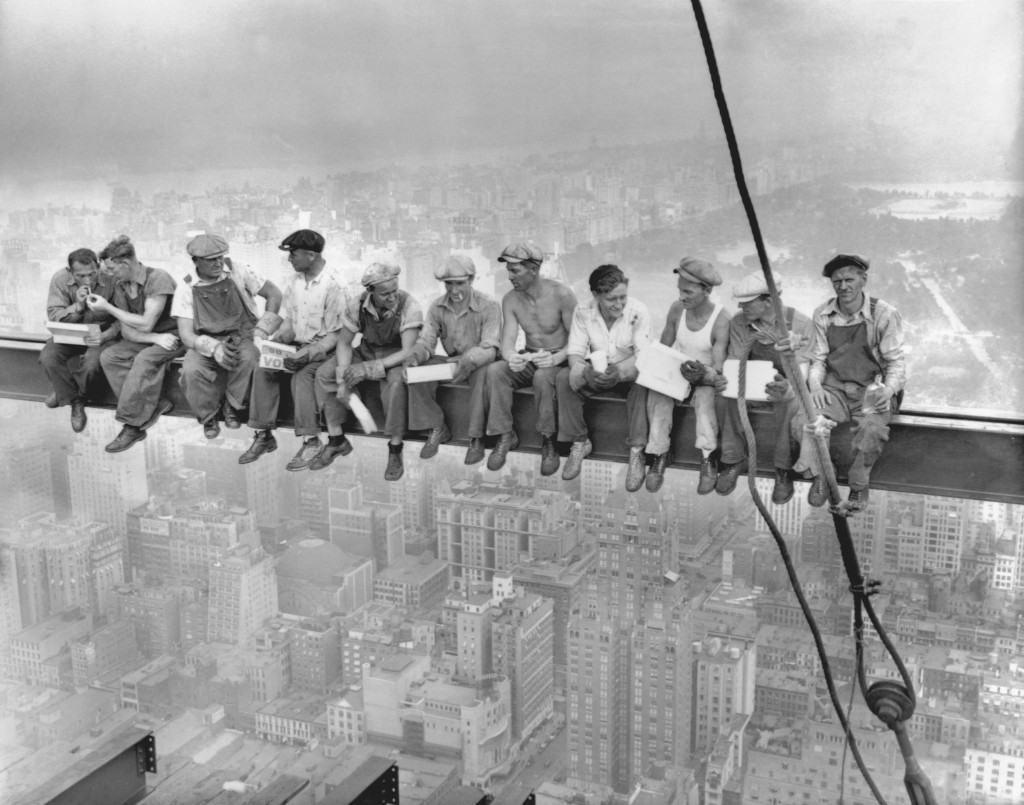 20 Sep 1932, Manhattan, New York City, New York State, USA --- Construction workers eat their lunches atop a steel beam 800 feet above ground, at the building site of the RCA Building in Rockefeller Center. --- Image by © Bettmann/CORBIS